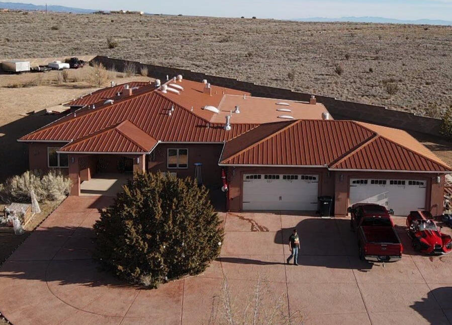 New copper-colored metal roof installed on a residential home in Albuquerque, New Mexico, enhancing the property's aesthetic appeal.